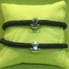 2 black silk cord macramé bracelets w/ Reversible .925 sterling silver Coquí Charms in matte and high polish finish