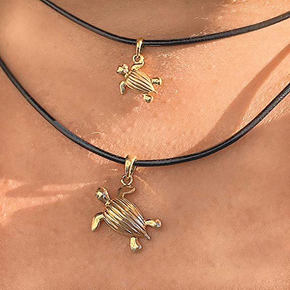 Neck wearing 14K gold mini and regular-size leatherback sea-turtle pendants